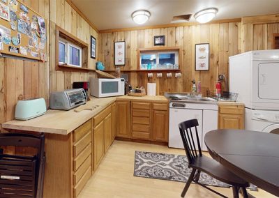 The kitchen, stove and washer/dryer